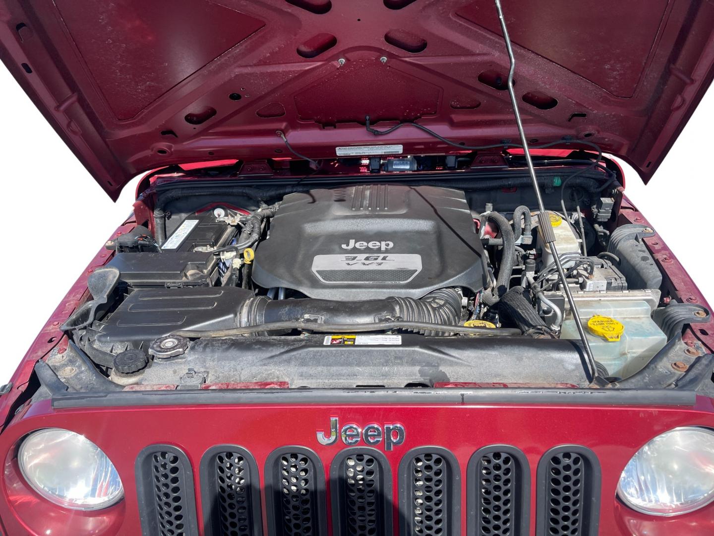 2012 Red /Black Jeep Wrangler Unlimited Sport 4WD (1C4BJWDG3CL) with an 3.6L V6 DOHC 24V engine, 5-Speed Automatic transmission, located at 547 E. Main St., Orwell, OH, 44076, (440) 437-5893, 41.535435, -80.847855 - This 2012 Jeep Wrangler Unlimited Sport with 4WD features a robust 3.6-liter Pentastar V6 engine paired with a 5-speed automatic transmission. It is equipped with a Dana 44 rear axle and a Dana 30 front axle, ensuring durable and reliable off-road capabilities. The model comes with a hardtop convert - Photo#16